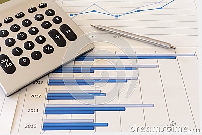 Office desk with charts , histograms and financial documents Stock Photo