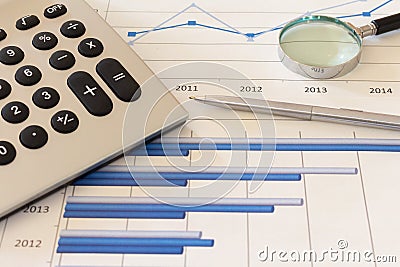 Office desk with charts , histograms and financial documents Stock Photo