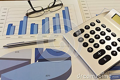 Office desk with charts , histograms and financial documents Stock Photo