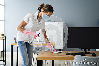 Office Desk Cleaning Service. Professional Janitor Stock Photo