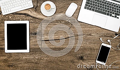 Office desk laptop, coffee, tablet pc, smartphone Home office Stock Photo