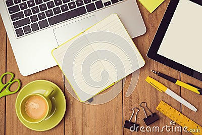 Office desk mock up template with laptop, notebook and tablet. View from above Stock Photo