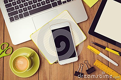 Office desk mock up template with laptop and smart phone. View from above Stock Photo