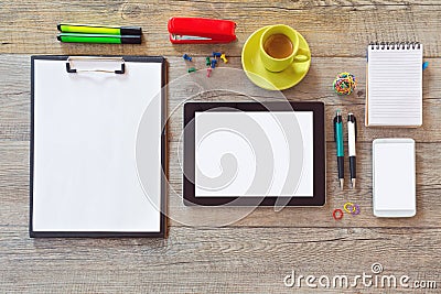 Office desk mock up template with tablet, smart phone, notebook and cup of coffee. View from above with copy space Stock Photo