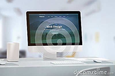 Office desk with modern computer monitor and responsive web site off web design studio Stock Photo