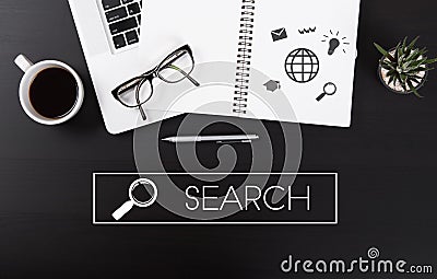 Office desk with notebook computer and wording Search business. Stock Photo