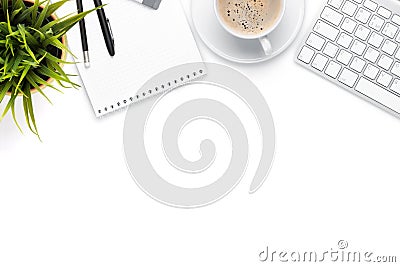 Office desk table with computer, supplies, coffee cup and flower Stock Photo