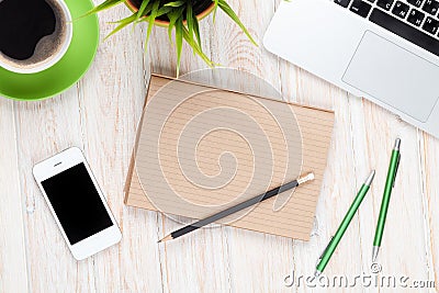 Office desk table with computer, supplies, coffee cup and flower Stock Photo