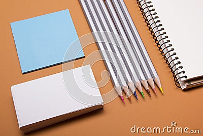 Office desk table with supplies top view. Notepad, pencil and blank business card colorful paper. Copy space for text Stock Photo