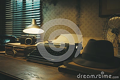 Vintage film noir office desk with old typewriter Stock Photo