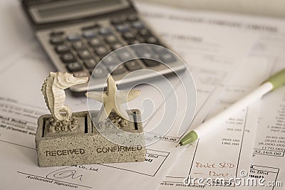 Office document with rubber stamp, pen and calculator Stock Photo