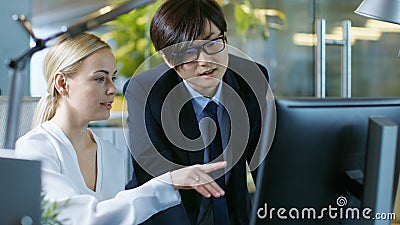 In the Office East Asian Businessman Plays Video Games on His Sm Stock Photo