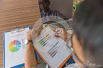 Office employee checking financial number on sale report Stock Photo