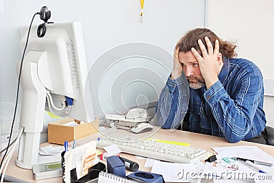 Office employee on his working place Stock Photo