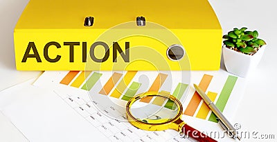 Office folder with text ACTION with charts, magnifier and pen Stock Photo