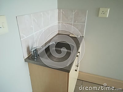 Office kitchenette with small basin Stock Photo
