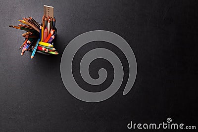Office leather desk table with colorful pencils Stock Photo