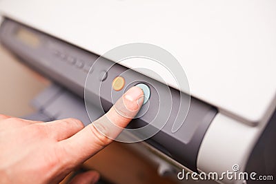 Office life, hand pressing start button Stock Photo