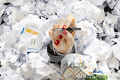 Office life or job stress in a hard day with businesswoman hand covered with documents to be signed Stock Photo