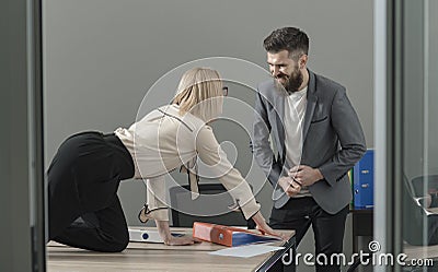 Office manager seduce boss on desktop. Office romance and sexual flirt concept Stock Photo