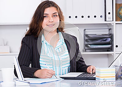 Office manager woman is having productive day at work Stock Photo