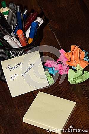 Office objects and sticky note or post it with text Recipe for success Stock Photo