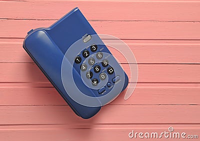 Office phone on a pink wooden table. on form Stock Photo