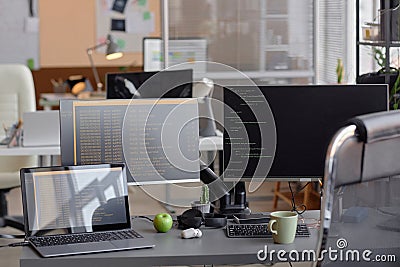 Office Programming Desk Setup with Computer and Laptop Stock Photo
