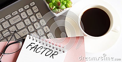 Office supplies, devices, coffee and glasses on white table with text FACTOR Stock Photo