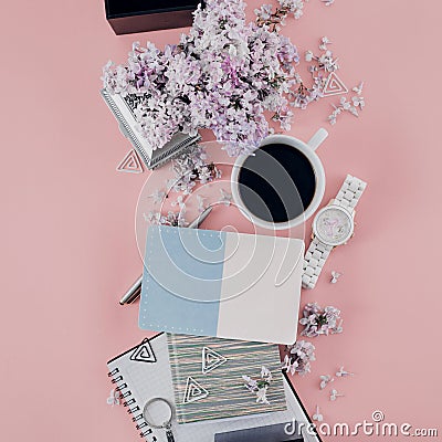 Office table desk flowers Top view Flat lay Home office workspace Women office accessories pink background Stock Photo