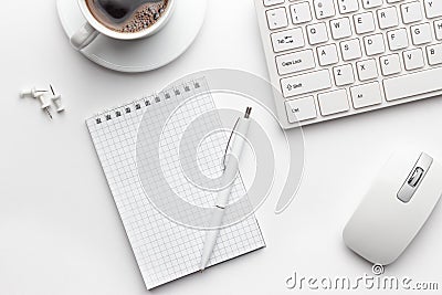 Office table with notepad, computer and coffee cup Stock Photo