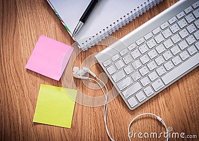 Office table with notepad, computer keyboard, coffee cup , pen , Editorial Stock Photo