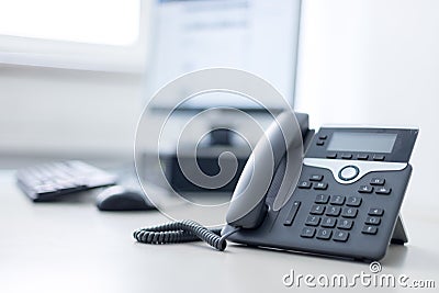 Classical black telephone in the office, customer support and telesale Stock Photo