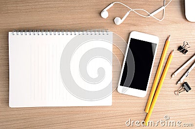 Office wooden desk table with smartphone. Top view with copy space. Stock Photo