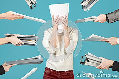 An office worker hid behind a document, Office worker overworked Stock Photo