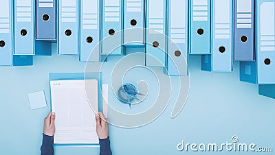 Office worker and archive binders Stock Photo