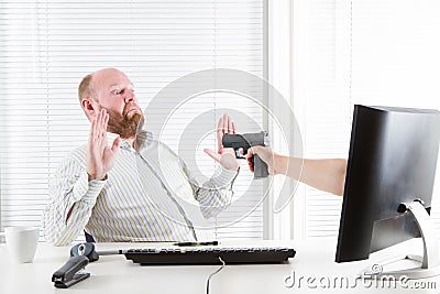 Businessman Threatened by Computer Stock Photo