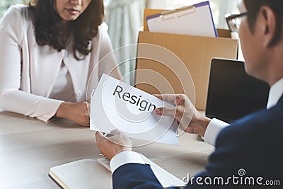 Office worker sending resignation letter to manager Stock Photo