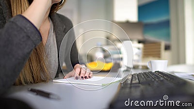 Office worker talking on phone with client, female informing about meeting Stock Photo