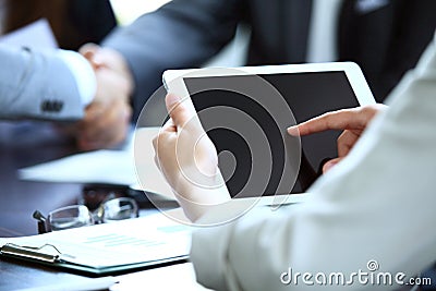 Office worker using a touchpad to analyze statistical data Stock Photo