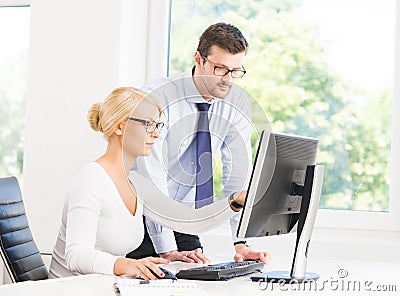 Office workers in formalwear working in office Stock Photo