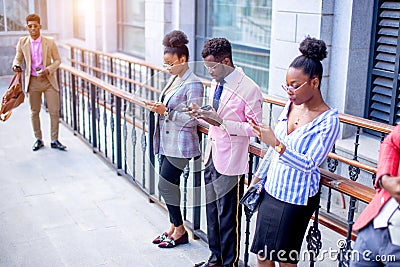 Office workers are surfing the net and not notice their boss Stock Photo