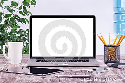 Office workplace with open laptop mockup tablet computer Stock Photo