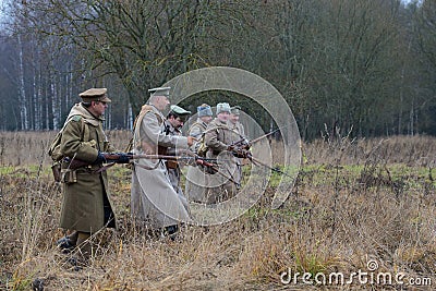 The officer with the soldiers of the white guard army of general Yudenich are put forward on the line of attack. International mil Editorial Stock Photo