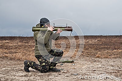 Officer special operations forces Ukraine army shoots from a grenade launcher Stock Photo