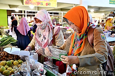 Officer from the trade office while checking the chemical content in food Editorial Stock Photo