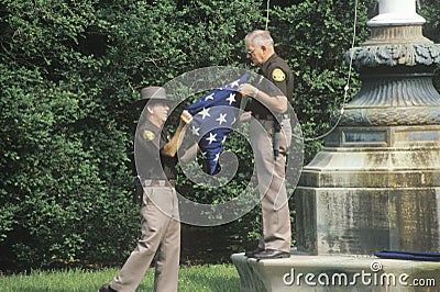 Officers Folding the American Flag Editorial Stock Photo