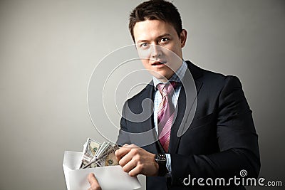 Official in business suit takes bribe, corruption Stock Photo