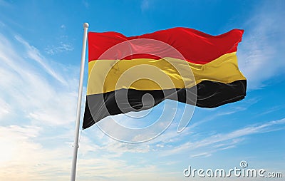 official flag of Belgium 1830 , Belgium at cloudy sky background on sunset, panoramic view. Belgian travel and patriot concept. Cartoon Illustration