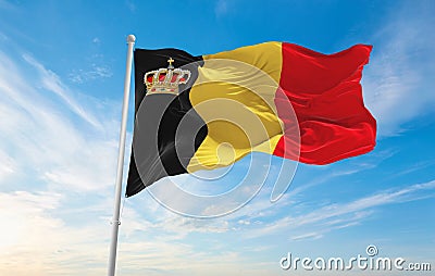 official flag of Belgium with crown , Belgium at cloudy sky background on sunset, panoramic view. Belgian travel and patriot Cartoon Illustration